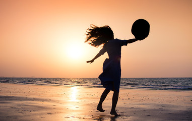 Sticker - Girl on the beach at sunset