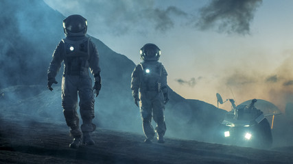 Wall Mural - two astronauts in space suits confidently walking on alien planet, exploration of the the planet's s