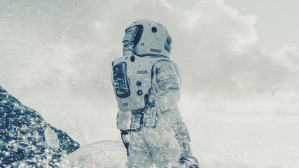 Wall Mural - shot of the astronaut looking through the snow storm on frozen alien planet. in the background his b