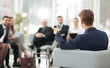 © ASDF - image is blurred.businessman conducting a meeting