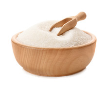 Wooden bowl and scoop with pure sugar on white background