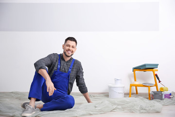 Sticker - young male decorator on floor in room