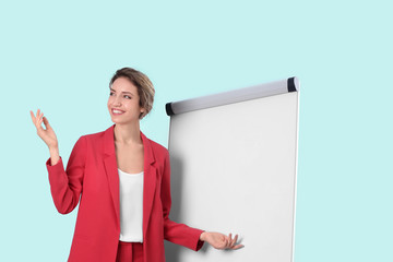 Sticker - Female business trainer giving presentation on whiteboard against light background