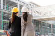 © PR Image Factory - Female engineer showing a building project.