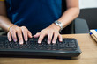 © NVB Stocker - Female office worker typing on the keyboard