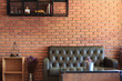 Vintage room with sofa set brick wall background.