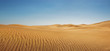 Leinwandbild Motiv Dunes at empty desert, panoramic nature background with copy space