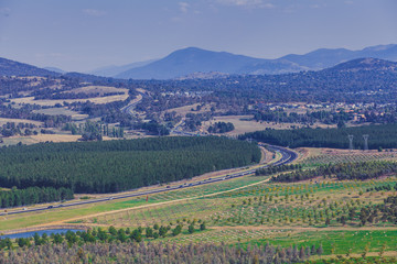 Wall Mural - Winding highway through mountains and countryside in Canberra, ACT, Australia