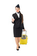 © LIGHTFIELD STUDIOS - Young stewardess with suitcase looking at smartphone isolated on white