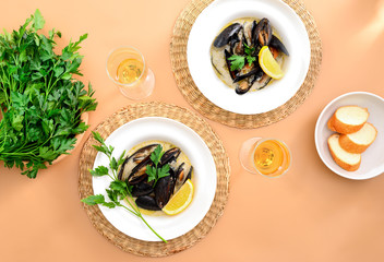 Wall Mural - Mussels in creamy garlic and wine sauce served with white wine