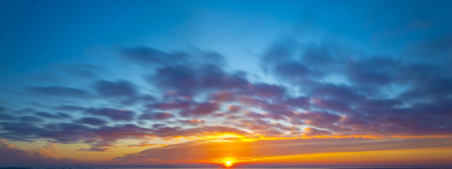 Wall Mural - fiery sunset, colorful clouds in the sky,panorama