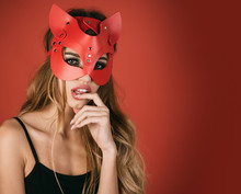 Glamor Fashion Sexy Woman In Cat Mask. Isolated On Red Background. Christmas Masquerade Party, Carnival, New Year, Halloween Concept - Sexy Portrait Of Woman Wearing Cat Mask.