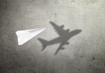 paper plane shadow concept