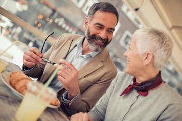 Wall Mural - Senior couple having breakfast in cafe