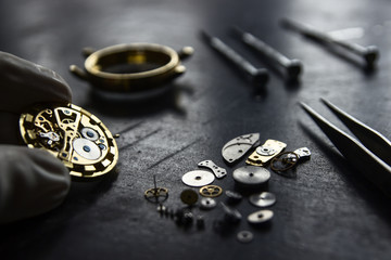 Watchmaker is repairing the mechanical watches in his workshop