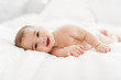 © Louis-Photo - Portrait of a baby boy on the bed in bedroom
