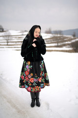 Wall Mural - Slovakian folklore woman in winter