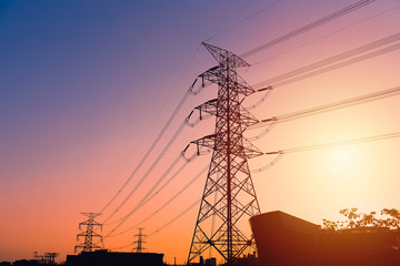 Silhouette high voltage post or High voltage tower with twilight