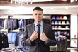 © Africa Studio - Young man wearing elegant suit in boutique
