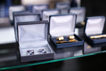 Sticker - Boxes with cufflinks on shelf in boutique