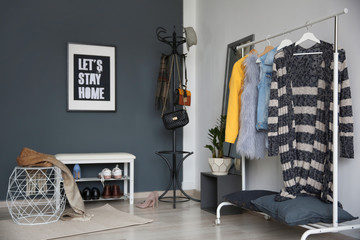 Poster - Stylish hallway interior with clothes rack and coat stand