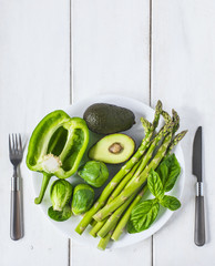 Poster - Green vegetables  on a white plate. Healthy food.