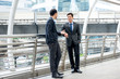 © Atstock Productions - Asian businessmen talking together on a day break outdoors