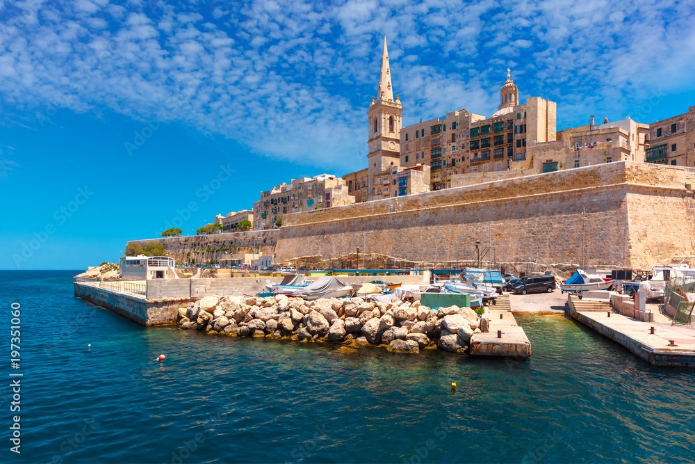 Valletta Skyline with fortress wall, boat pier and St. Paul's Anglican Pro-Cathedral, Valletta, Capital city of Malta. View from the sea - obrazy, fototapety, plakaty 