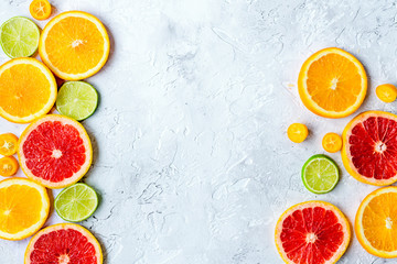 sliced citrus on stone table background top view mock up