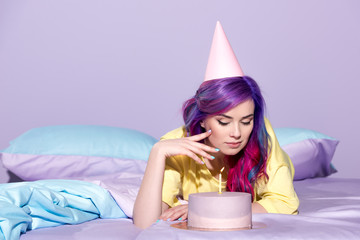 Wall Mural - beautiful young woman with birthday cake in bed