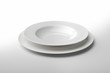 © antoniotruzzi - Empty round white plate and bowl