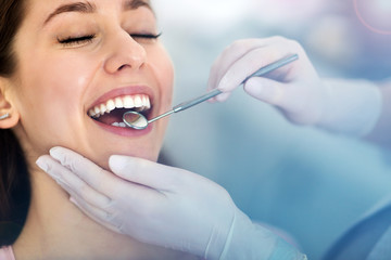 Sticker - Woman having teeth examined at dentists
