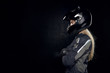 © Anatoliy Karlyuk - Sideways shot of attractive young blonde Caucasian female wearing styling outfit and black safety helmet crossing hands on chest, posing at blank studio wall with copy space for your advertisement