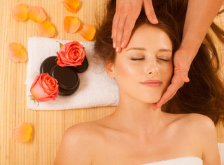 Wall Mural - Face Massage. Close-up of a Young Woman Getting Spa Treatment