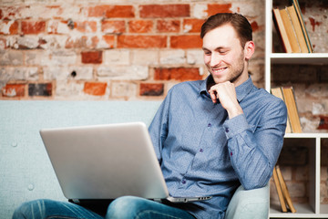 Canvas Print - Young man with a laptop