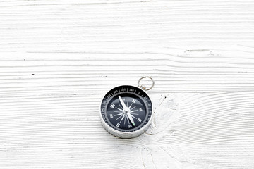 Wall Mural - Direction concept with compass on white wooden background top view mockup