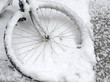 snow covered bicycle on sidewalk, New York City
