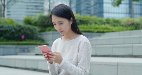 Poster - Woman working on cellphone at outdoor