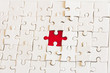 © Tinnakorn - red jigsaw puzzle And white.