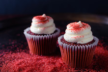 Red Velvet Cupcakes With Cream Cheese Icing And Red Sprinkles