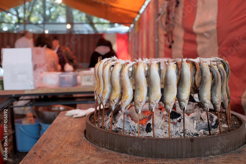 お祭りや縁日の屋台で食べる鮎の塩焼き Stock Photo Adobe Stock