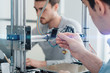 © StockPhotoPro - Engineering students using a 3D printer
