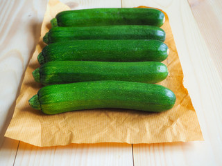 Fresh zucchini on kraft paper.
