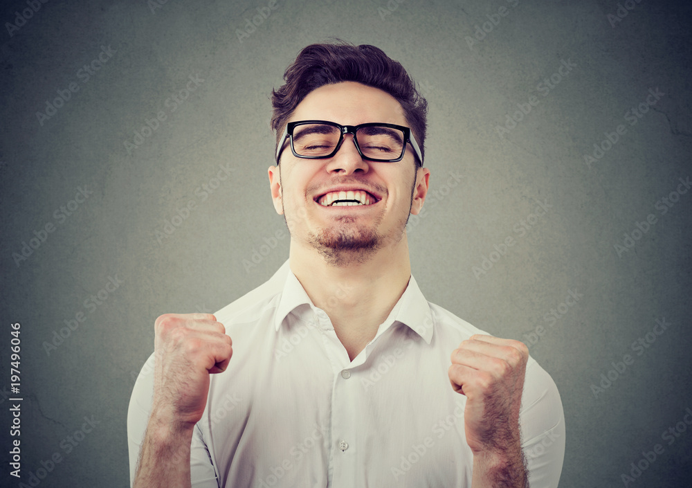 Excited man feeling relief with win - obrazy, fototapety, plakaty 