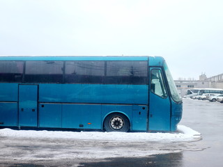 blue bus in the parking lot