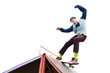 © yanik88 - Teen skater in a hoodie sweatshirt and jeans slides over a ramp on a skateboard isolated on white