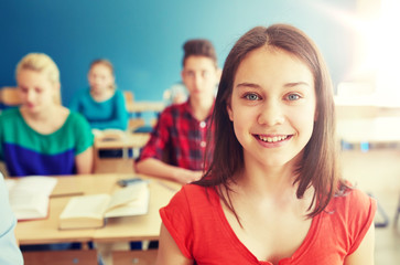 Canvas Print - education, learning and people concept - happy student girl at school lesson