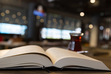 Wall Mural - tea concept. tea and book on the wooden background. cafe concept.