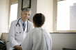 © Erickson Stock - Senior doctor consulting his patient in hospital