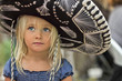 © Erickson Stock - Girl in sombrero standing outdoors